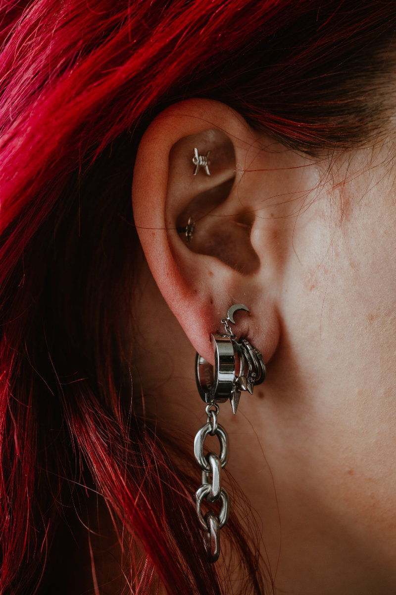 Woman getting piercing